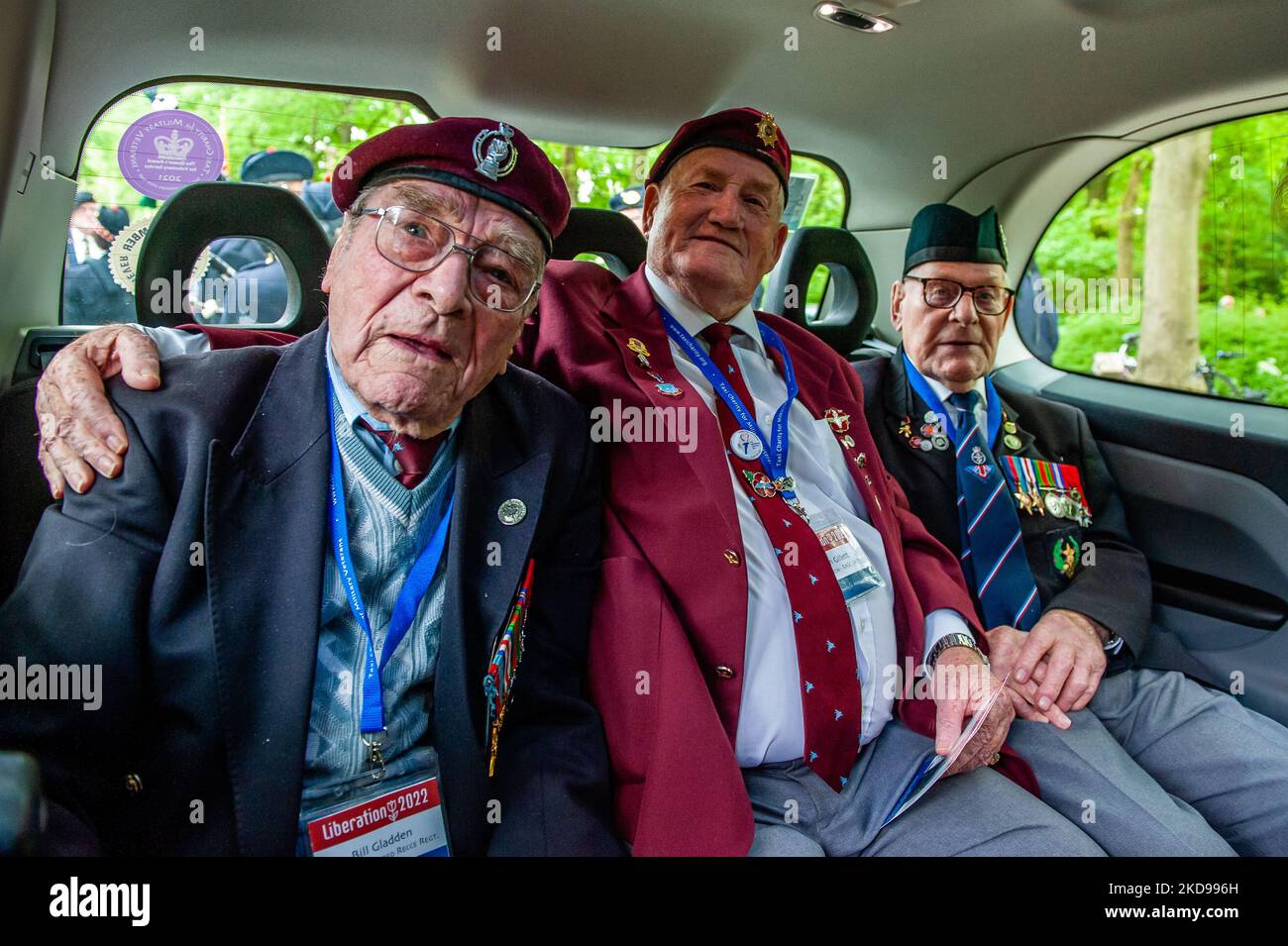 A group of WWII British veterans is posing for the camera, inside of one of the British black cabs to participate in the Liberation parade held again in Wageningen on May 5th, 2022. (Photo by Romy Arroyo Fernandez/NurPhoto) Stock Photo