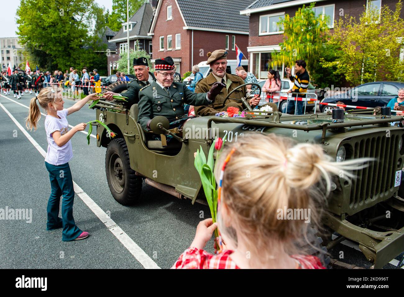 Children are giving flowers to the WWII veterans, during the Liberation Parade held again in Wageningen, on May 5th, 2022. (Photo by Romy Arroyo Fernandez/NurPhoto) Stock Photo