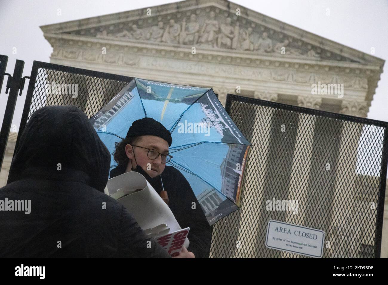 Pro-abortion rights demonstrators protest in the rain outside of the Supreme Court in Washington, D.C. on May 6, 2022, following the leak of a draft Supreme Court opinion to overthrow Roe vs. Wade (Photo by Bryan Olin Dozier/NurPhoto) Stock Photo