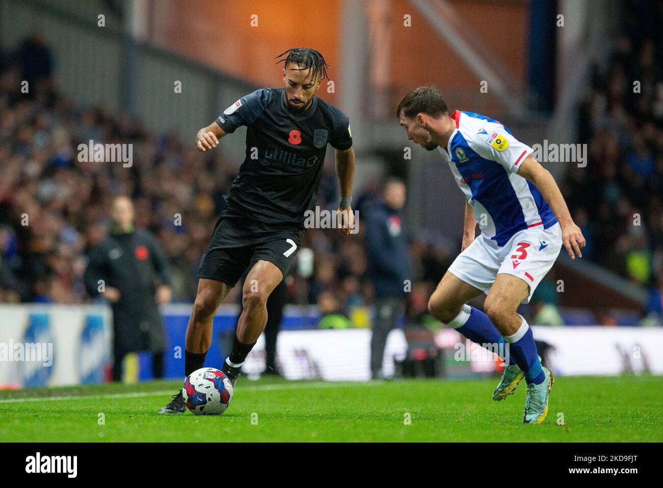 Sorba Thomas #7 of Huddersfield Town runs at Harry Pickering #3 of Blackburn Rovers with the ball during the Sky Bet Championship match Blackburn Rovers vs Huddersfield Town at Ewood Park, Blackburn, United Kingdom, 5th November 2022  (Photo by Phil Bryan/News Images) Stock Photo