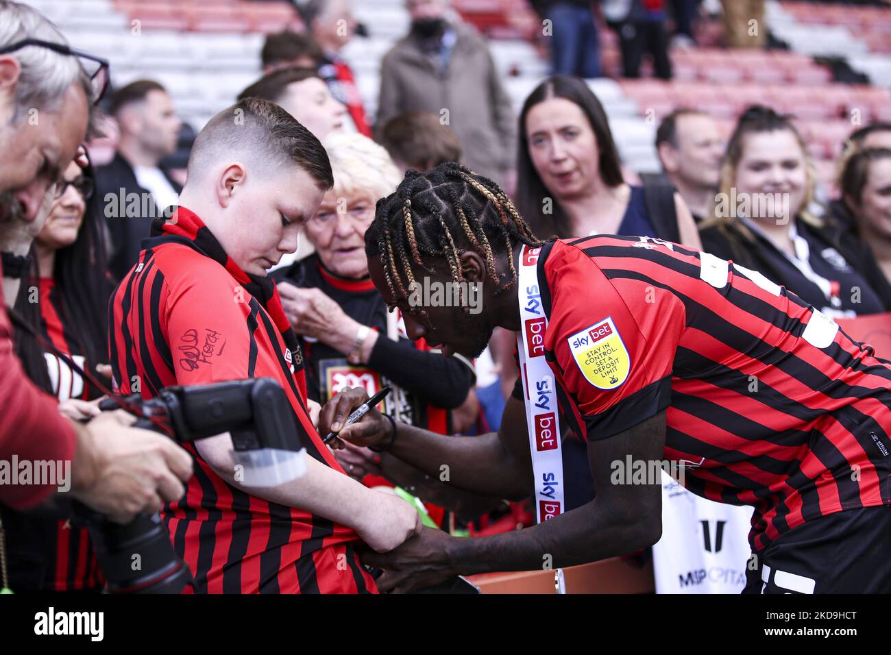 Jordan Zemura of AFC Bournemouth signs autographs for fans post match during the Sky Bet Championship match between Bournemouth and Millwall at the Vitality Stadium, Bournemouth on Saturday 7th May 2022. (Photo by Tom West/MI News/NurPhoto) Stock Photo