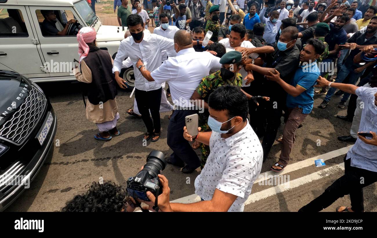 sri-lankan-opposition-leader-sajith-premadasa-is-escorted-back-to-his-vehicle-amid-tight-security-after-being-attacked-by-anti-government-protesters-during-a-clash-near-presidents-office-colombo-sri-lanka-9-may-2022-photo-by-tharaka-basnayakanurphoto-2KD9JCP.jpg