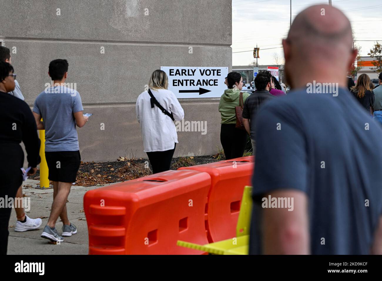 Residents wait in line to cast their ballots for the 2022 midterm