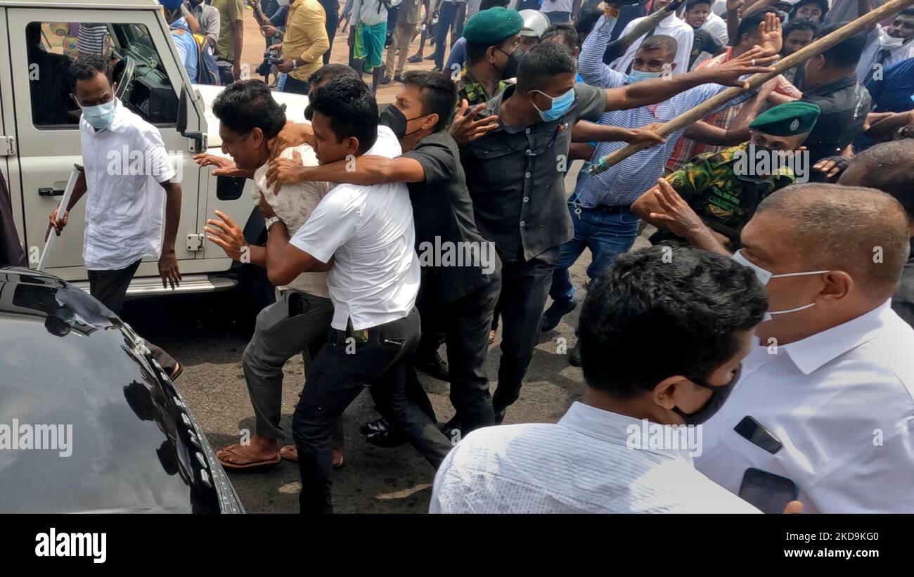 sri-lankan-opposition-leader-sajith-premadasa-is-escorted-back-to-his-vehicle-amid-tight-security-after-being-attacked-by-anti-government-protesters-during-a-clash-near-presidents-office-colombo-sri-lanka-9-may-2022-photo-by-tharaka-basnayakanurphoto-2KD9KG0.jpg