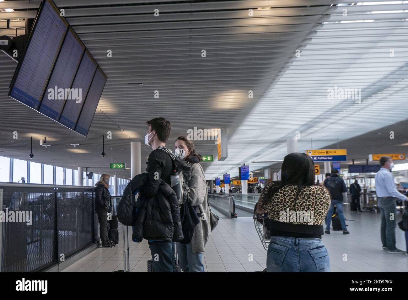 Passengers as seen wearing face masks inside the terminal, the