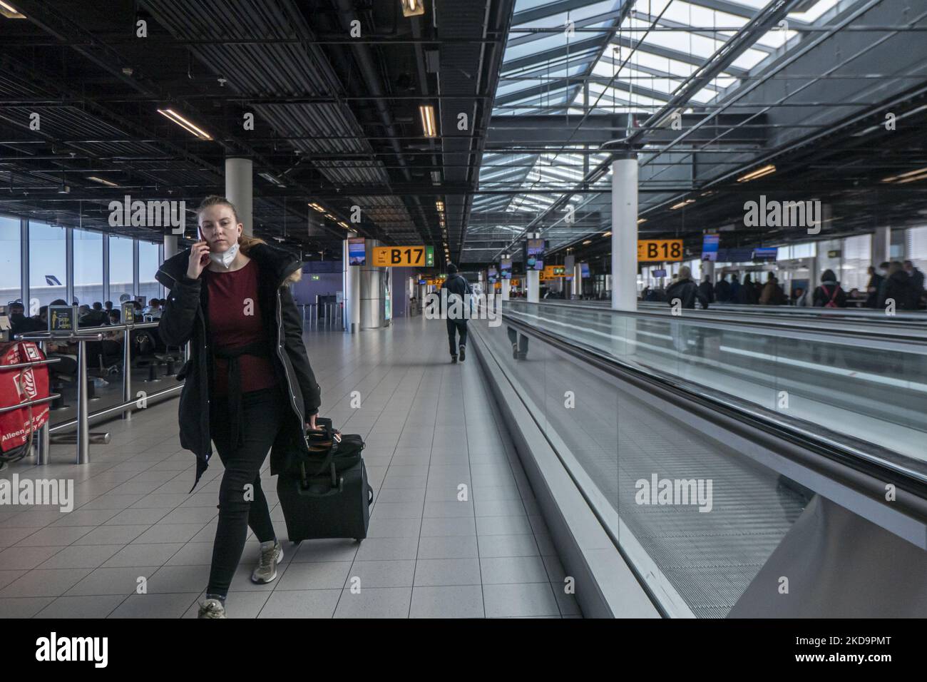 Passengers as seen wearing face masks inside the terminal, the