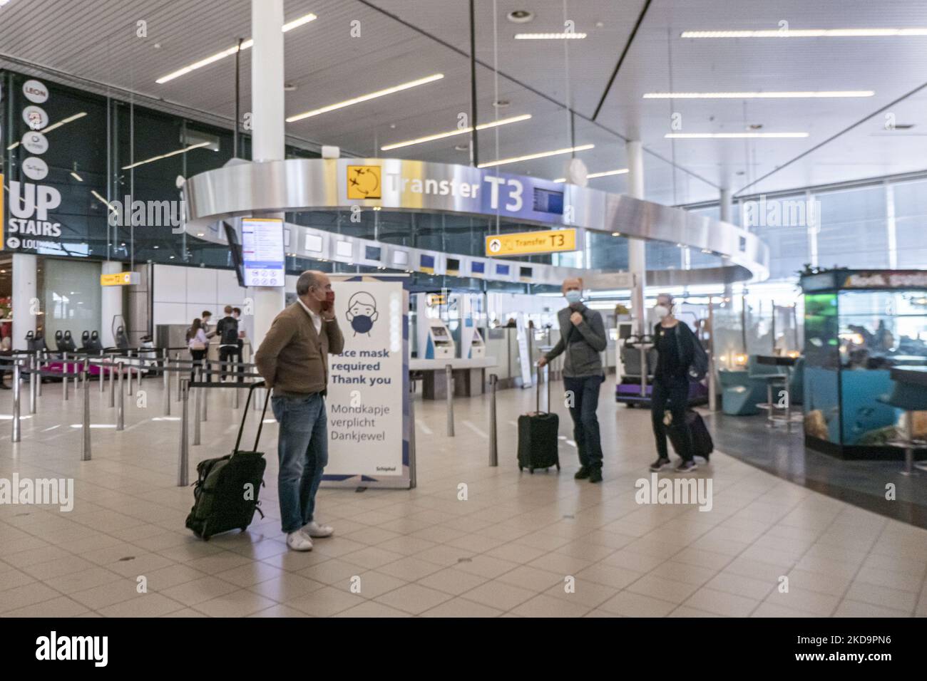 Passengers as seen wearing face masks inside the terminal, the
