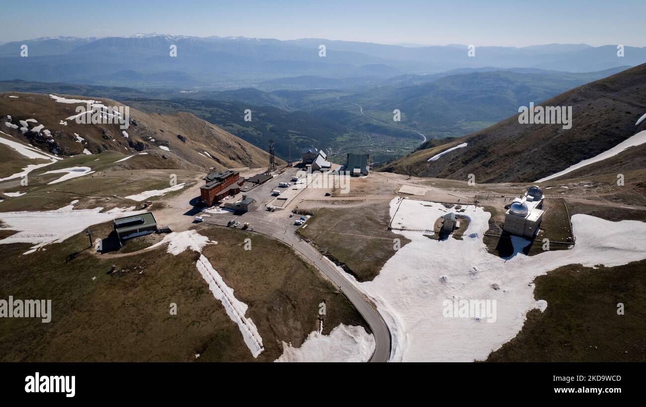 A drone view of Abruzzo Astronomical Observatory at 2.200 m above the sealevel, in Campo Imperatore, Italy, on May 13, 2022. -Gran Sasso d'Italia is a massif in the Apennine Mountains of Italy. Its highest peak, Corno Grande (2,912 metres), is the highest mountain in the Apennines, and the second-highest mountain in Italy outside the Alps. (Photo by Manuel Romano/NurPhoto) Stock Photo