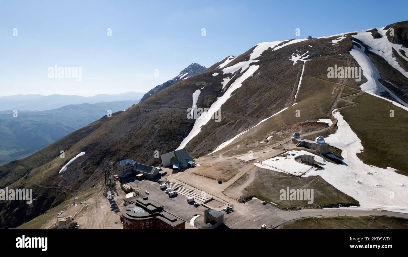 A drone view of Abruzzo Astronomical Observatory at 2.200 m above the sealevel , in Campo Imperatore, Italy, on May 13, 2022. -Gran Sasso d'Italia is a massif in the Apennine Mountains of Italy. Its highest peak, Corno Grande (2,912 metres), is the highest mountain in the Apennines, and the second-highest mountain in Italy outside the Alps. (Photo by Manuel Romano/NurPhoto) Stock Photo