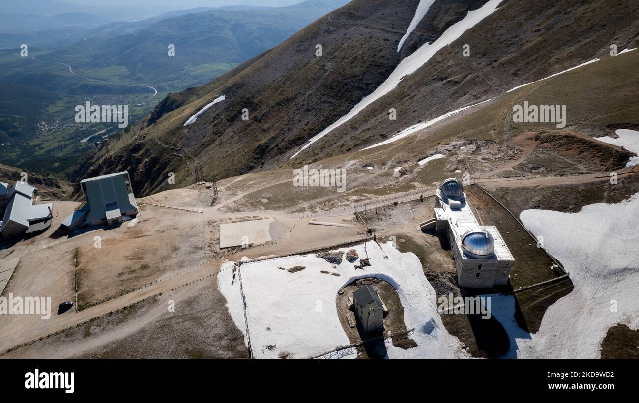 A drone view of Abruzzo Astronomical Observatory at 2.200 m above the sealevel, in Campo Imperatore, Italy, on May 13, 2022. -Gran Sasso d'Italia is a massif in the Apennine Mountains of Italy. Its highest peak, Corno Grande (2,912 metres), is the highest mountain in the Apennines, and the second-highest mountain in Italy outside the Alps. (Photo by Manuel Romano/NurPhoto) Stock Photo