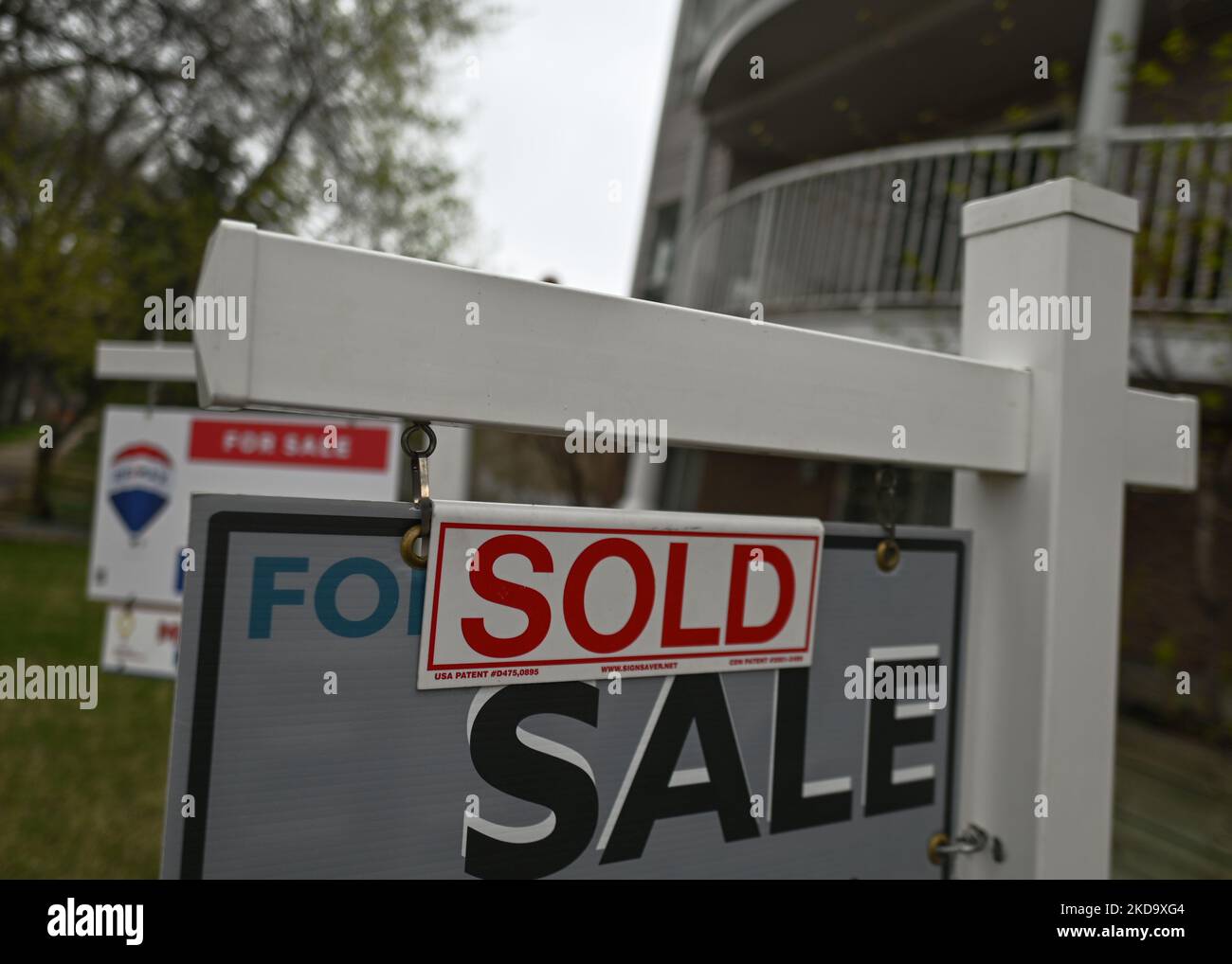 FOR SALE and SOLD signs seen outside houses in the center of Edmonton