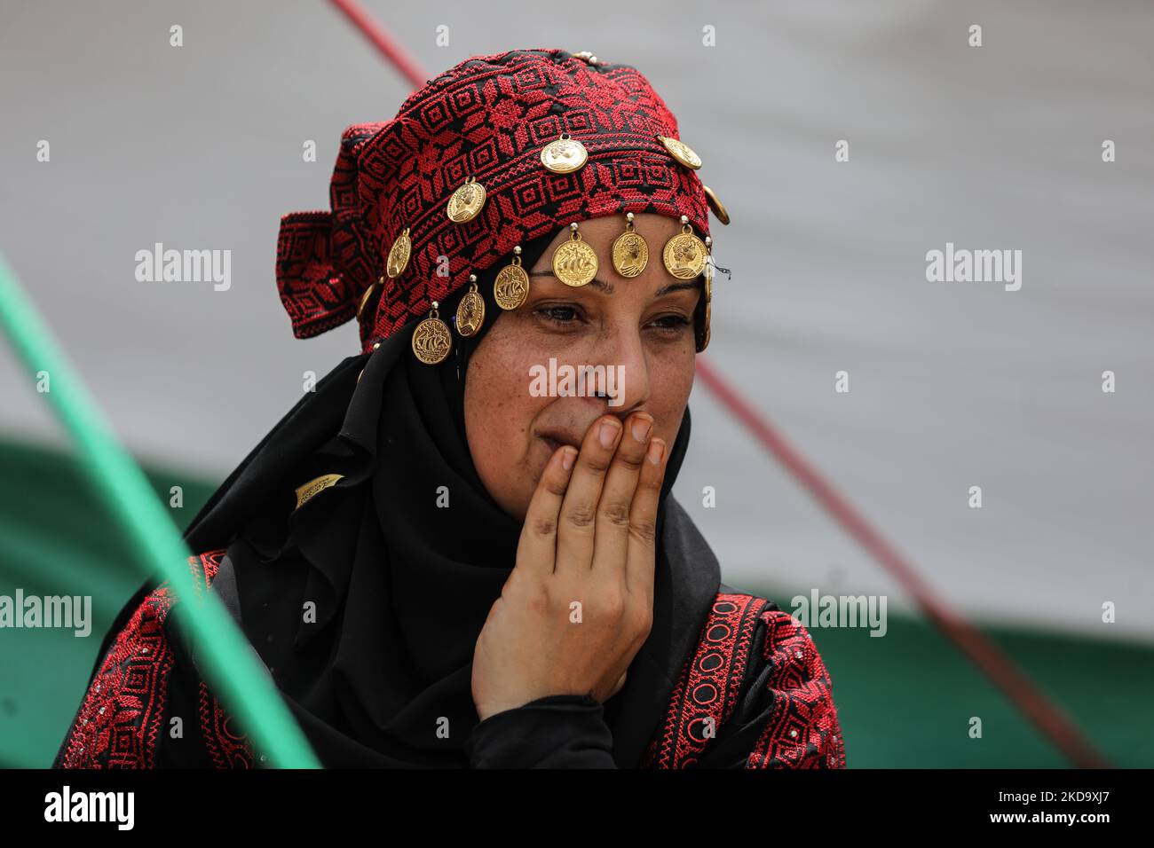 A Palestinian woman during a demonstration ahead of the 74th anniversary of the Nakba, the "catastrophe" of Israel's creation in 1948.in Gaza City, on May 14, 2022. - Palestinians and Arab Israelis commemorate the Nakba on May 15 -- the official date of Israel's creation according to the western calendar. Hundreds of thousands of Palestinians fled their homes or were forced out of them on the creation of Israel in 1948. Those who stayed in their villages when Israel was created are now described as Israeli Arabs, but the majority became refugees in the West Bank, Gaza Strip and neighbouring Ar Stock Photo