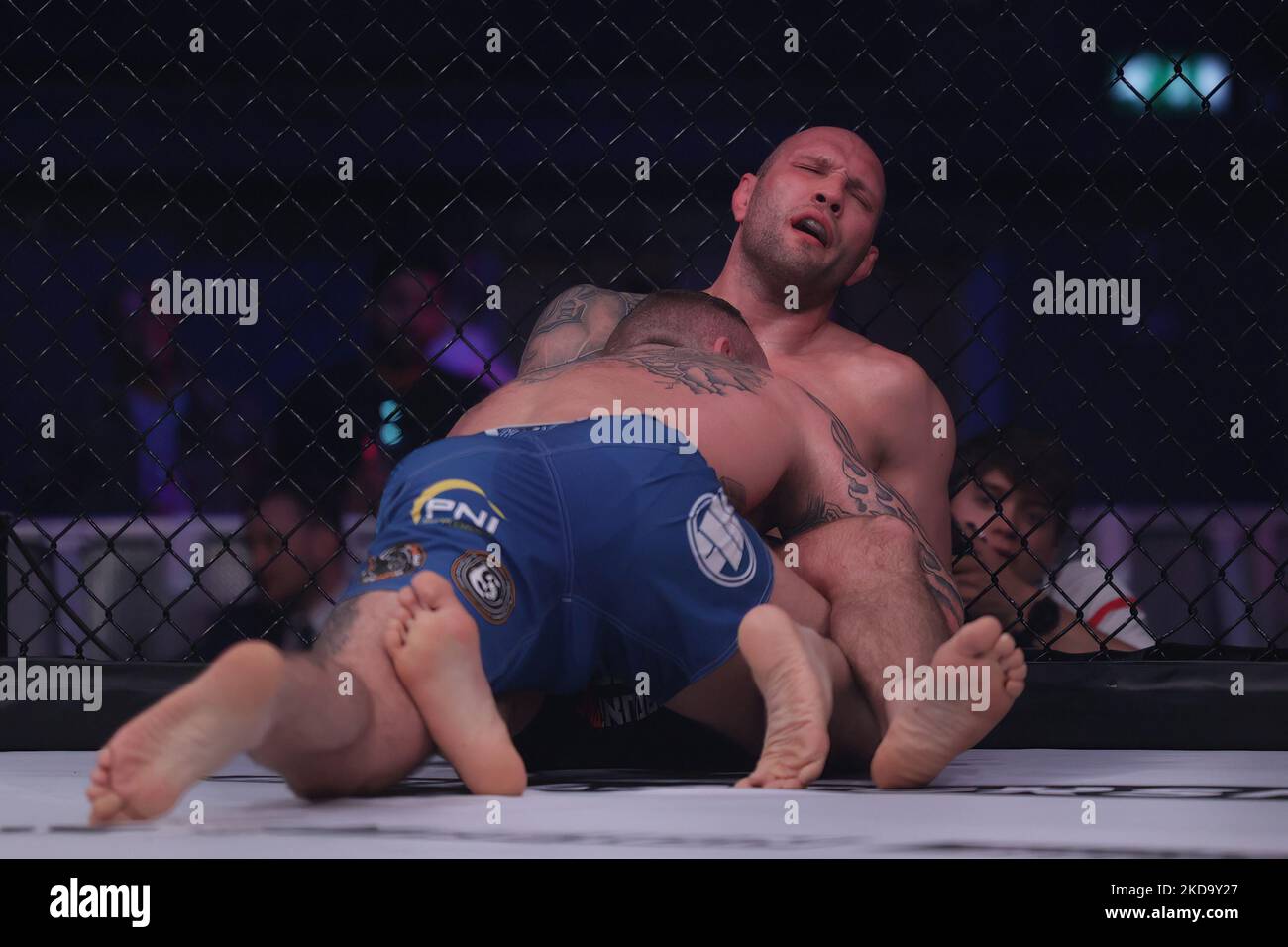 Maciej Rozanski is taken down by Lee Chadwick during the Bellator 281: MVP vs. Storley event at the SSE Arena, Wembley, London on Friday 13th May 2022. (Photo by Pat Scaasi/MI News/NurPhoto) Stock Photo