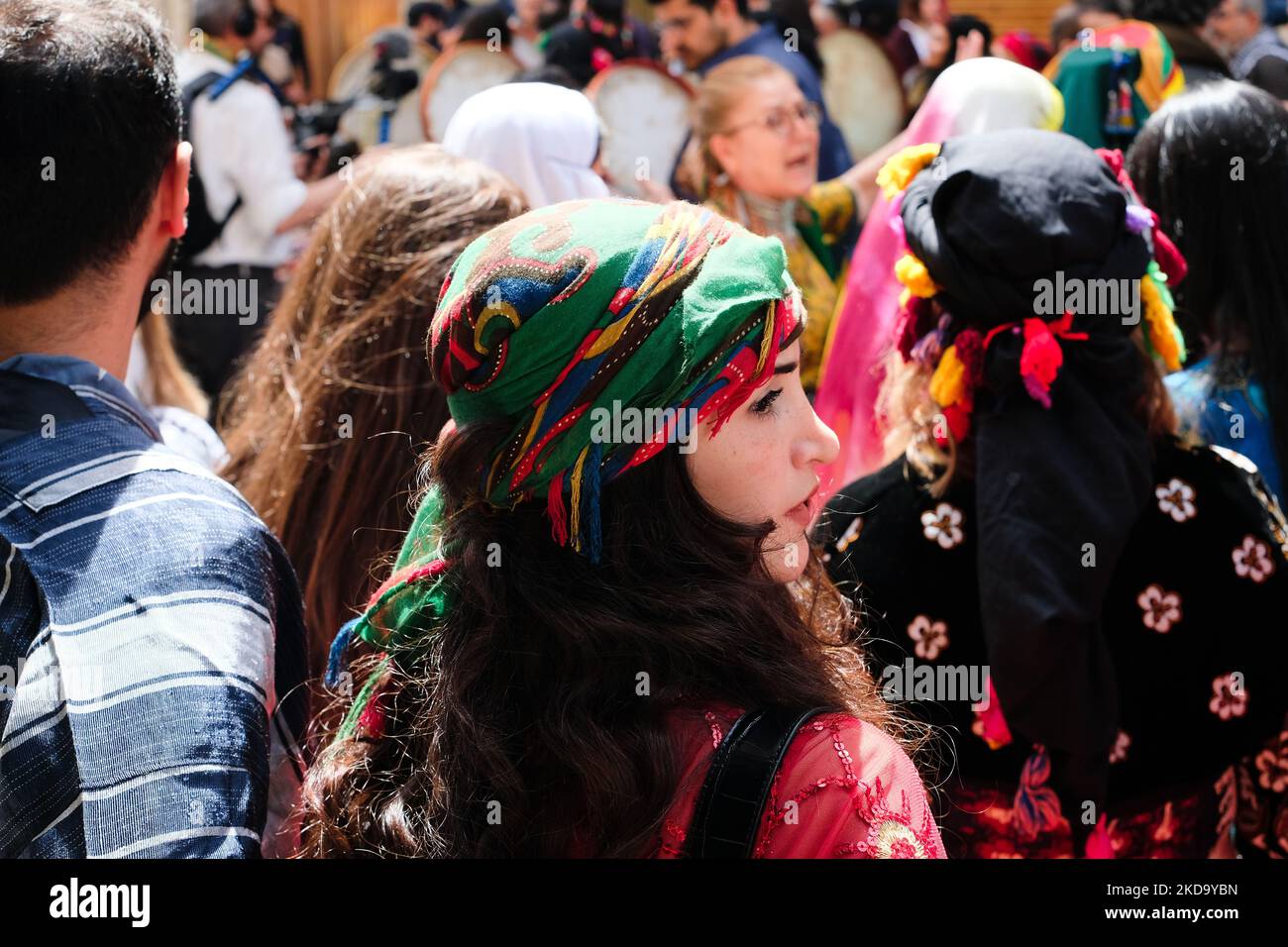 A Kurdish woman in traditional dress in the parade of the first Kurdish ...