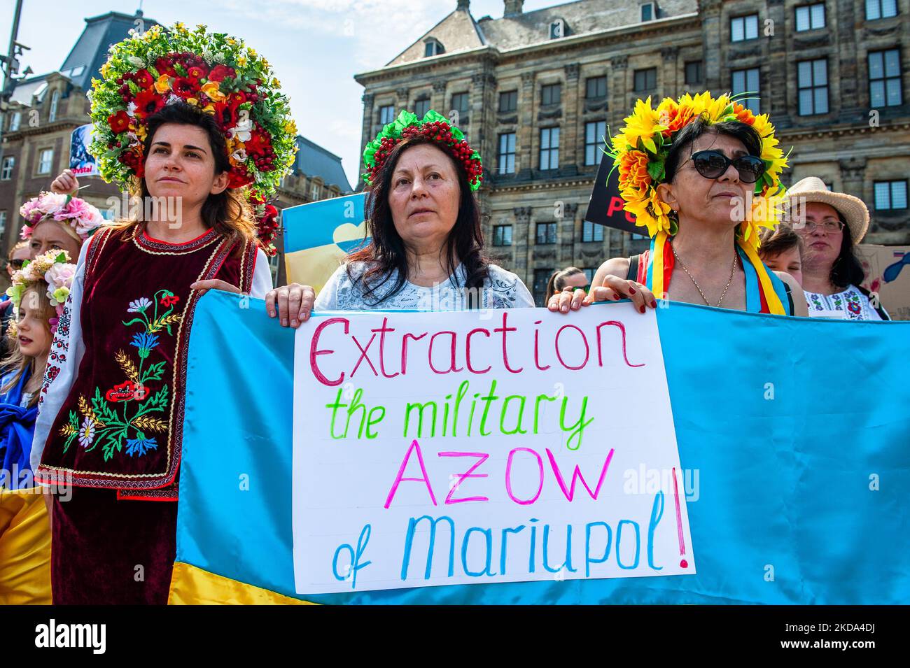 Ukrainian women are wearing traditional flower crowns during a