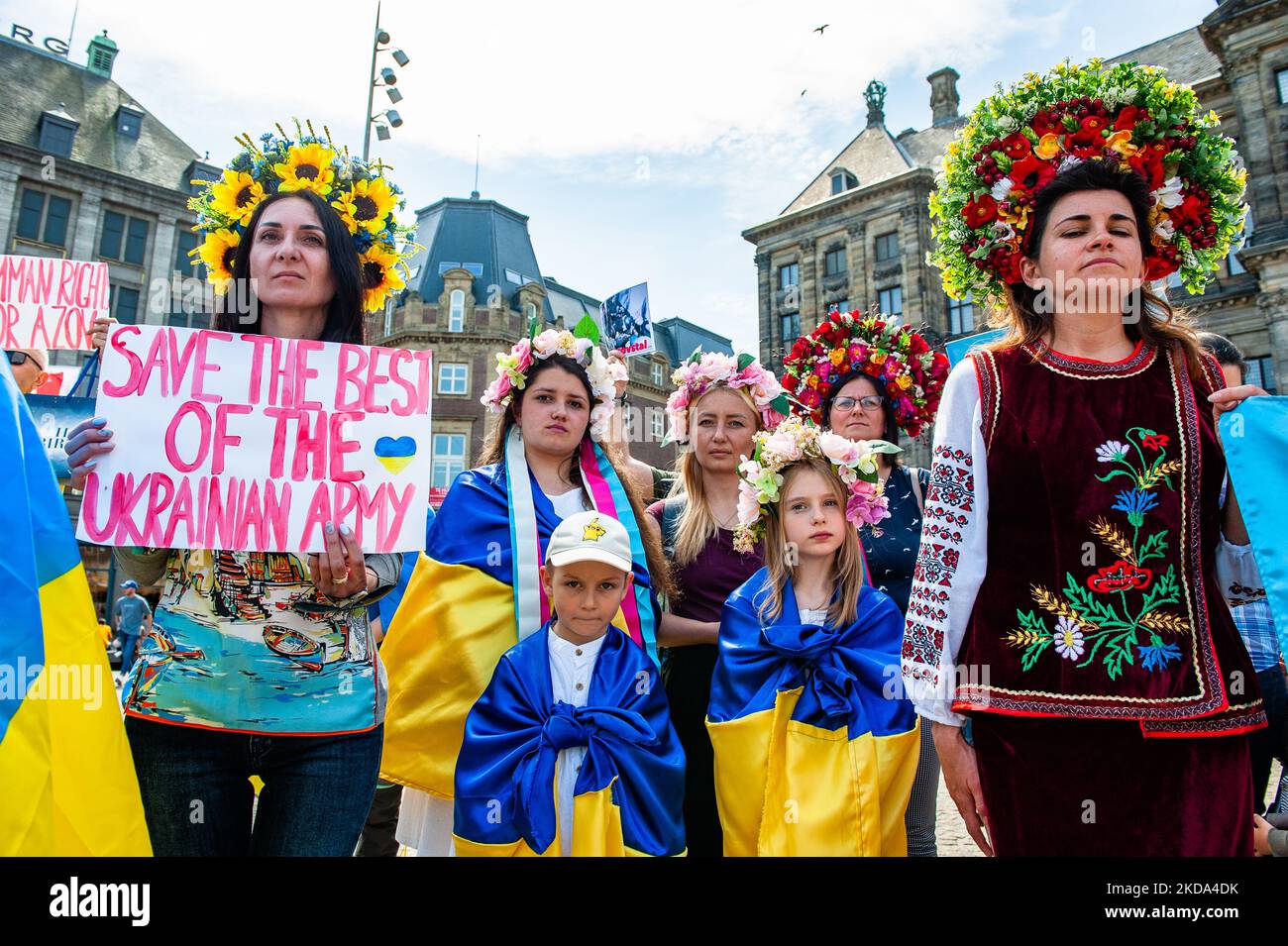 Ukrainian women are wearing traditional flower crowns during a