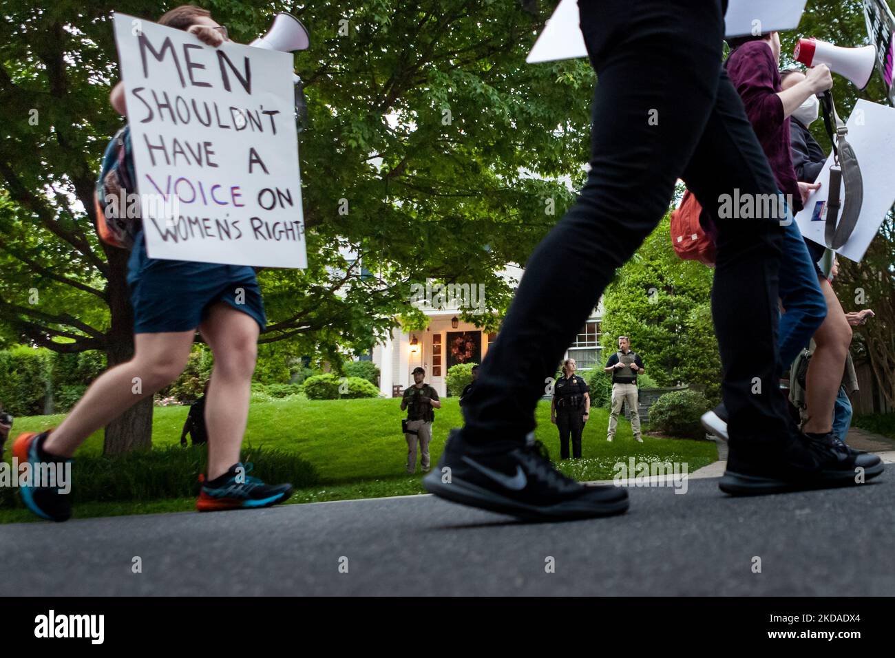 Prochoice protesters march past Chief Justice John Roberts’ house in