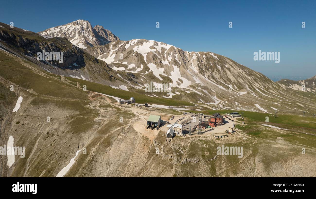 A drone view of the cable car of Campo Imperatore, also know as small Tibetin, in the Gran Sasso and Laga Mountains National Park, on May 21, 2022. -Gran Sasso d'Italia is a massif in the Apennine Mountains of Italy. Its highest peak, Corno Grande (2,912 metres), is the highest mountain in the Apennines, and the second-highest mountain in Italy outside the Alps. (Photo by Manuel Romano/NurPhoto) Stock Photo