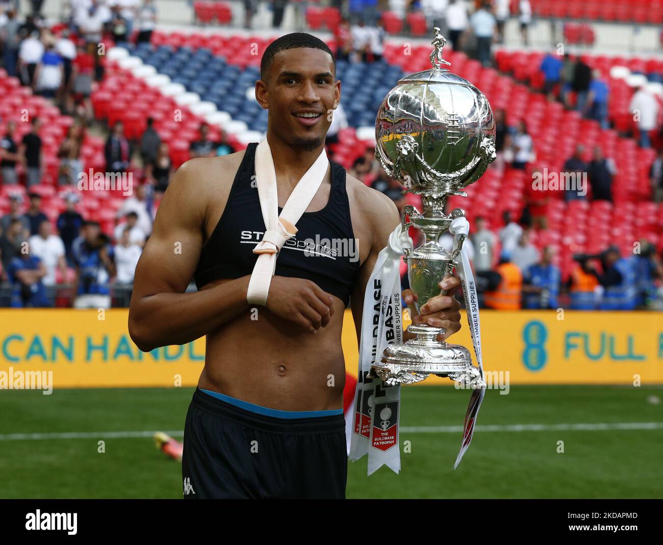 LONDON, ENGLAND - MAY 22: Omar Sowunmi of Bromley with FA Trophy after The Buildbase FA Trophy Final 2021/2022 between Bromley and Wrexham at Wembley Stadium , London, UK 22nd May , 2022 (Photo by Action Foto Sport/NurPhoto) Stock Photo
