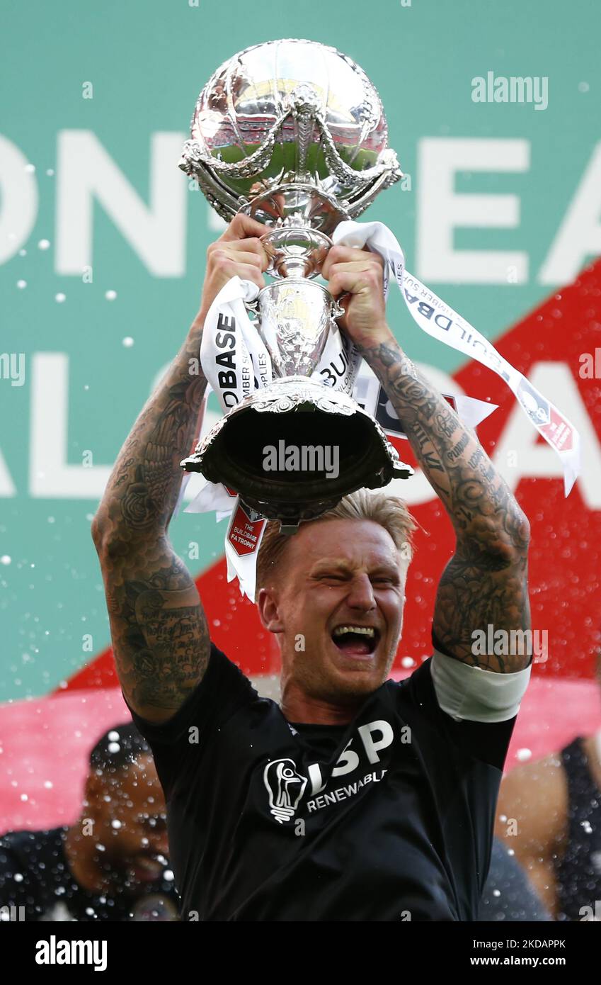 LONDON, ENGLAND MAY 22 Byron ster lift the FA Trophy after The