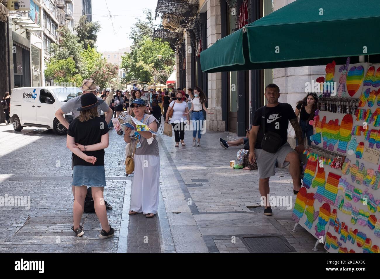 Tourists are looking at a map at Ermou street near Monastiraki square in  the center of Athens, Greece on May 25, 2022. (Photo by Nikolas  Kokovlis/NurPhoto Stock Photo - Alamy