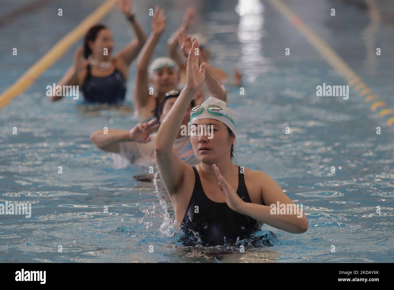 A group of inhabitants of Milpa Alta in Mexico City, during an exhibition of Aqua Zumba or zumba in the pool on the occasion of the 20th anniversary of the Tecoxpa pool in that town. (Photo by Gerardo Vieyra/NurPhoto) Stock Photo