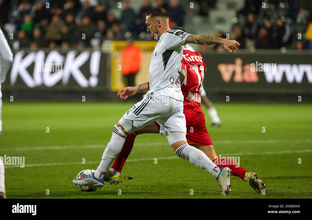 Eupen's Boris Lambert and Standard's Aron Donnum fight for the ball