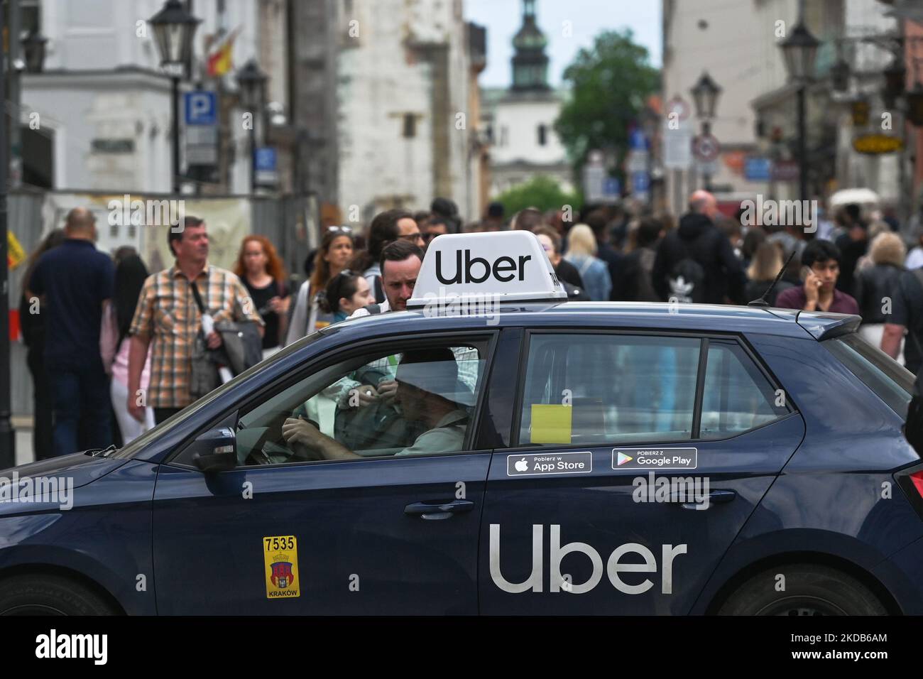 an-uber-car-is-waiting-for-customers-on-grodzka-street-in-the-center-of