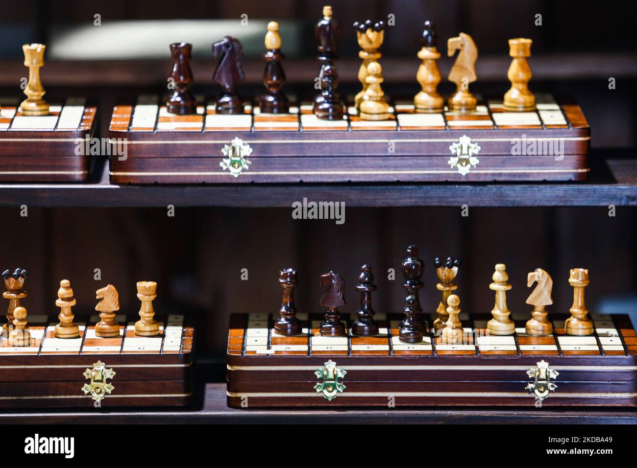 Wooden chessboards are seen on a stand in Krakow, Poland, on May 30, 2022. (Photo by Jakub Porzycki/NurPhoto) Stock Photo