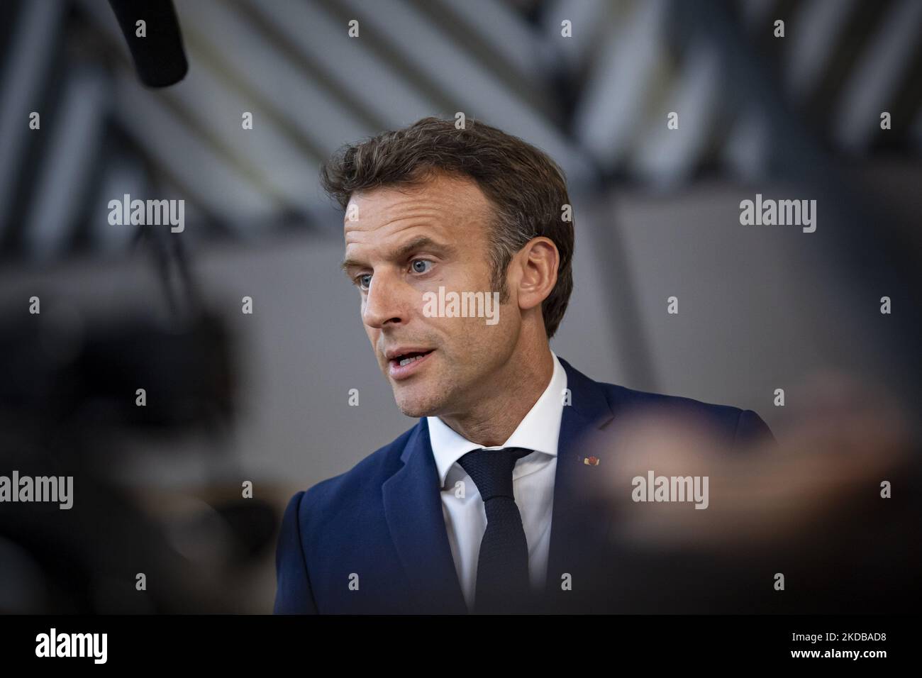 Emmanuel Macron President of the Republic of France talks to the media after the end of the 2-day extraordinary special EU summit about Ukraine, Energy and Defense, agreeing on a sixth wave of sanctions against Russia and Russian oil exports with special pipeline exemptions to Hungary. Meeting of the 27 EU leaders at the European Council in Brussels, Belgium on May 31, 2022 (Photo by Nicolas Economou/NurPhoto) Stock Photo