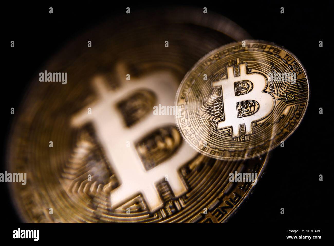 In this photo illustration a Bitcoin cryptocurrency logo is seen on a  smartphone screen with an AMC Entertainment Holdings logo in the  background. AMC plans to accept Bitcoin as payment, reportedly by