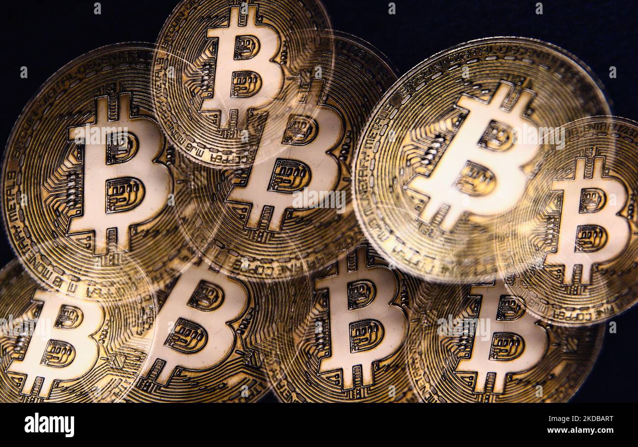 Representation of Bitcoin cryptocurrency and an illustrative chart are ...