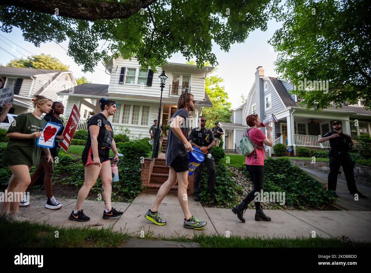Prochoice protesters pass in front of Supreme Court Justice Brett