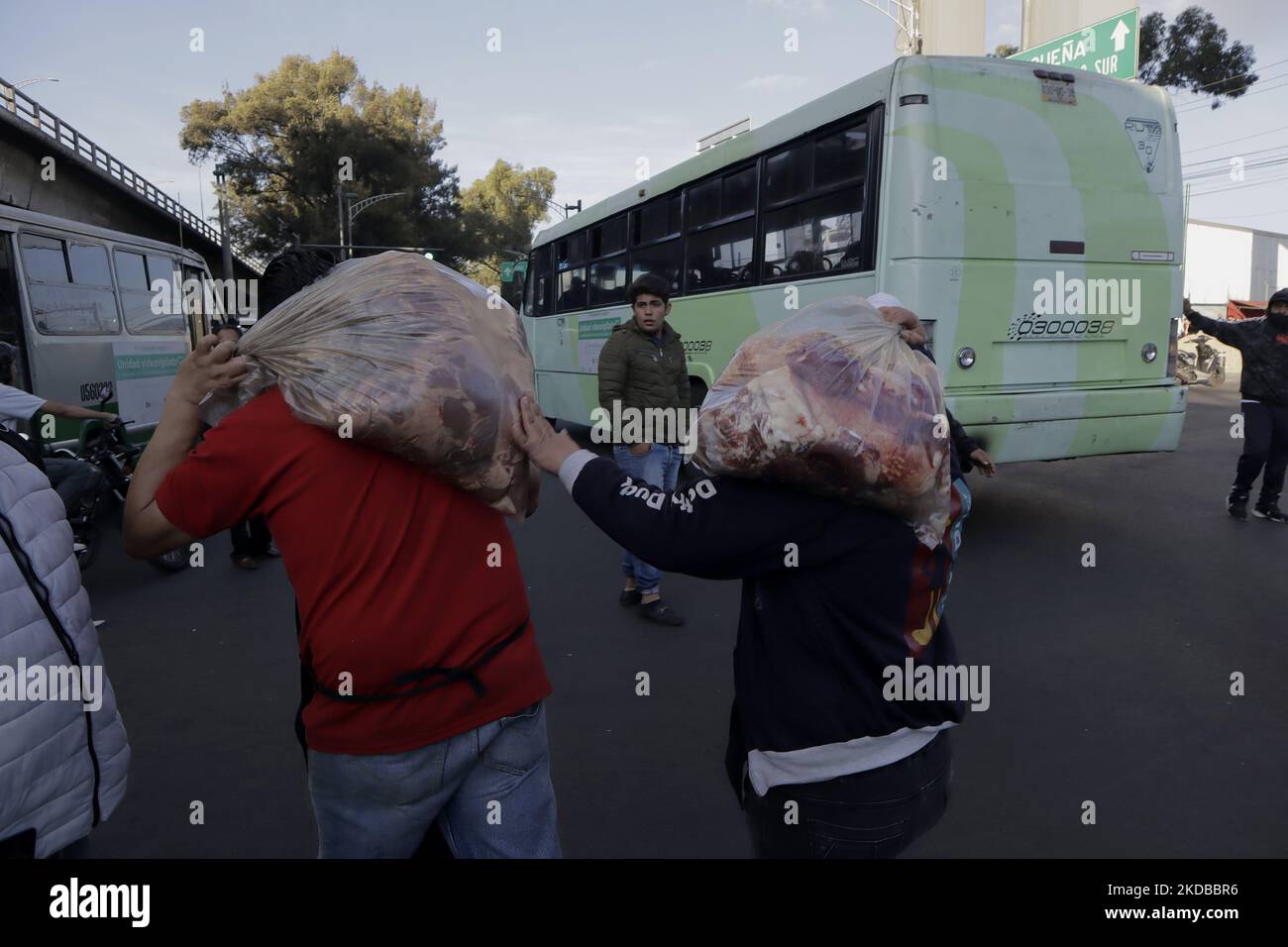 Public transport users carry bags of meat and look for alternative ...