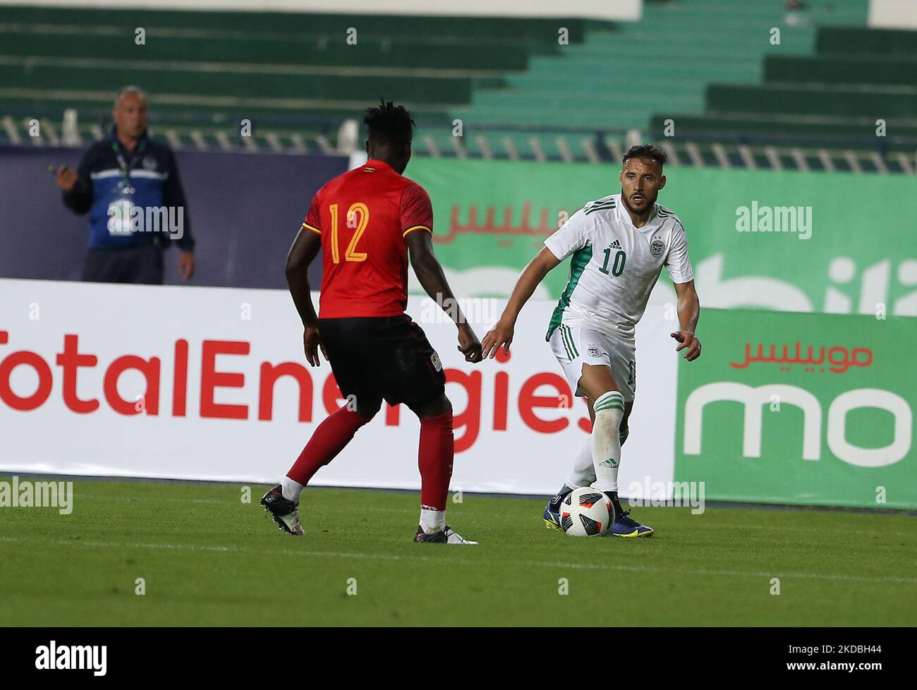 Algerian player Mohamed Youcef Belaili (R) vies for the ball with Ugandan player Kizito Mugweri Gavin (L) during the 2023 Africa Cup of Nations Qualifier soccer match between Algeria and Uganda at Stade du July 5, 1962 in Algiers, Algeria, June 4, 2022. (Photo by APP/NurPhoto) Stock Photo