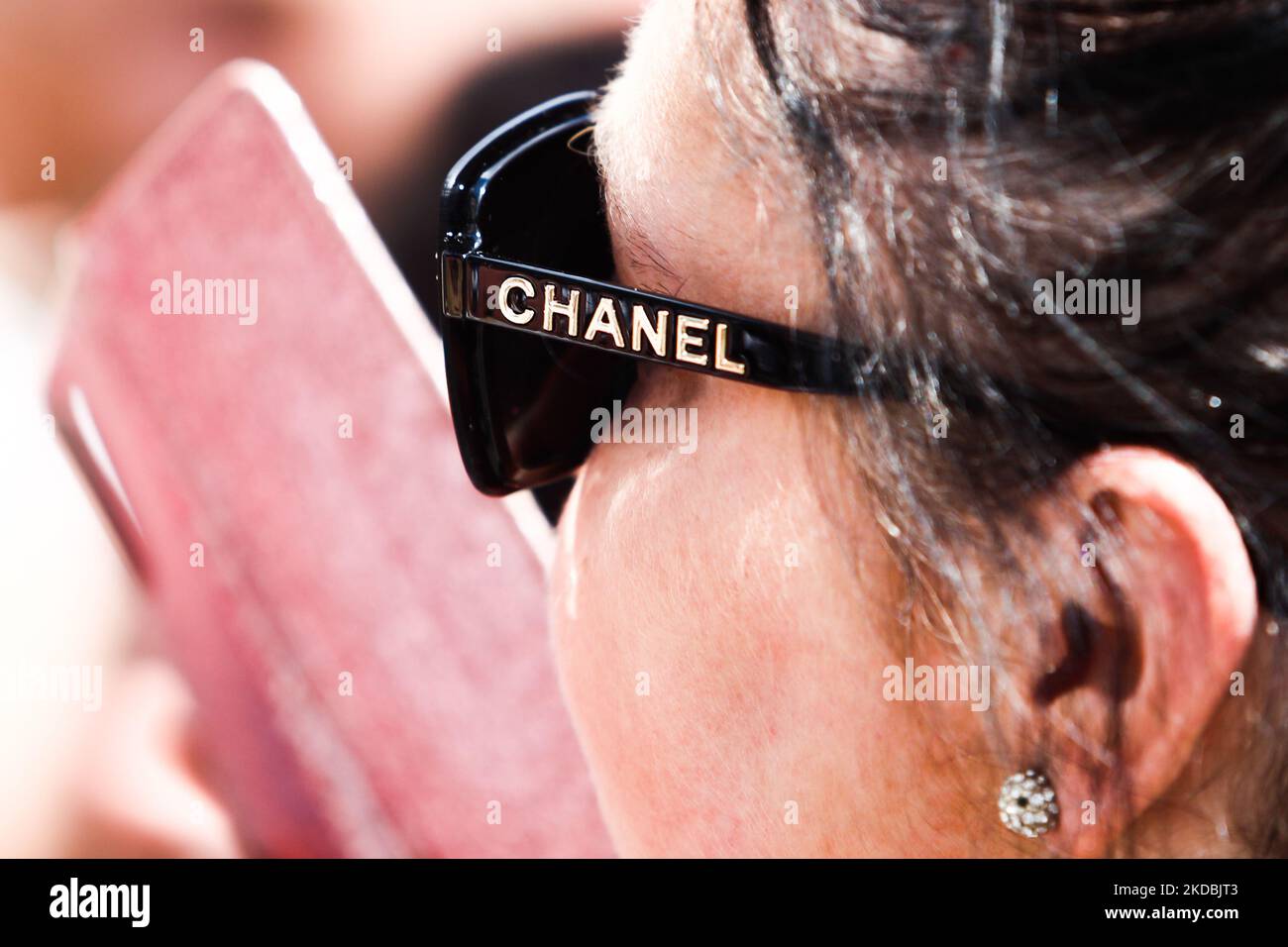Chanel logo is seen on a glasses wearing by a woman in Krakow, Poland on June 5, 2022. (Photo by Jakub Porzycki/NurPhoto) Stock Photo
