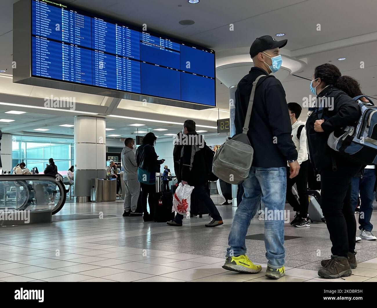 Travelers wearing face masks during the COVID19 pandemic at Toronto