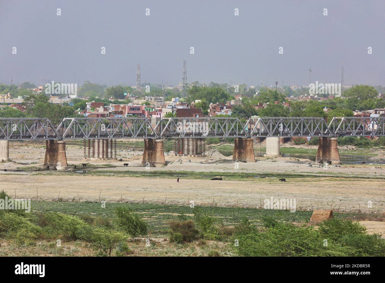 Rail bridge spans the Yamuna River (which has almost dried up due to