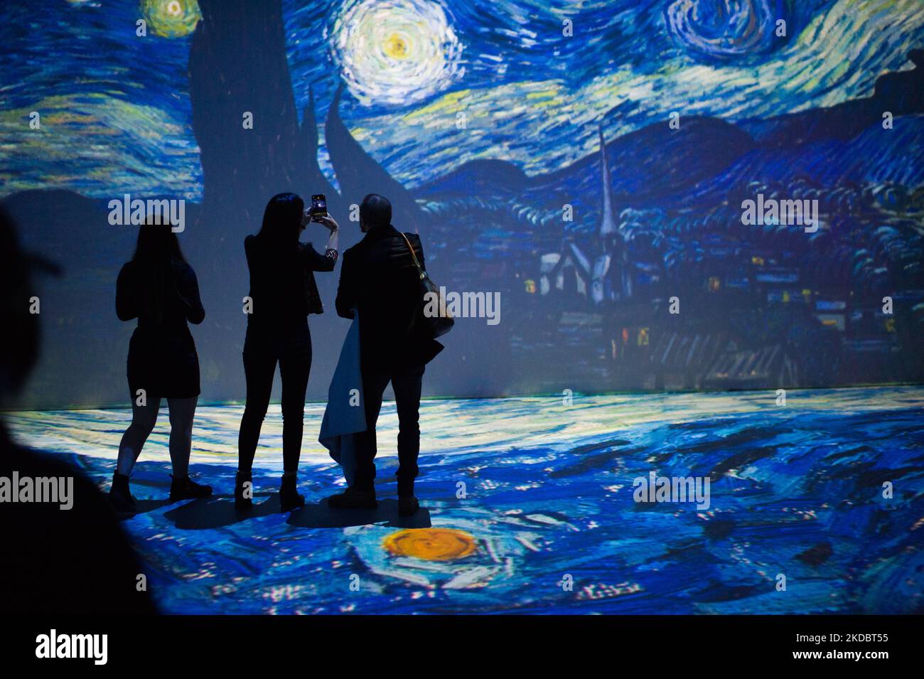 People take part in the immersive exhibition of Vincent Van Gogh's 'Beyond Van Gogh' experience that gathers his most important pieces of art, in Bogota, Colombia June 9, 2022. (Photo by Sebastian Barros/NurPhoto) Stock Photo