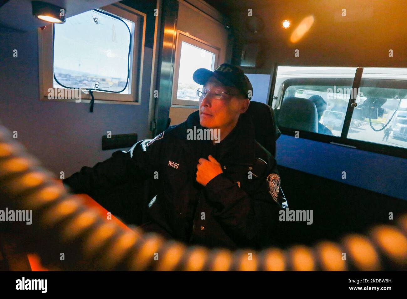 U.S. Customs and Border Protection officer Jim Wang looks over x-ray images of trucks entering Levi's Stadium during non-intrusive inspections prior to Super Bowl 50 in Santa Clara, Calif., Feb. 1, 2016. (U.S. Customs and Border Protection Photo by Glenn Fawcett) Stock Photo