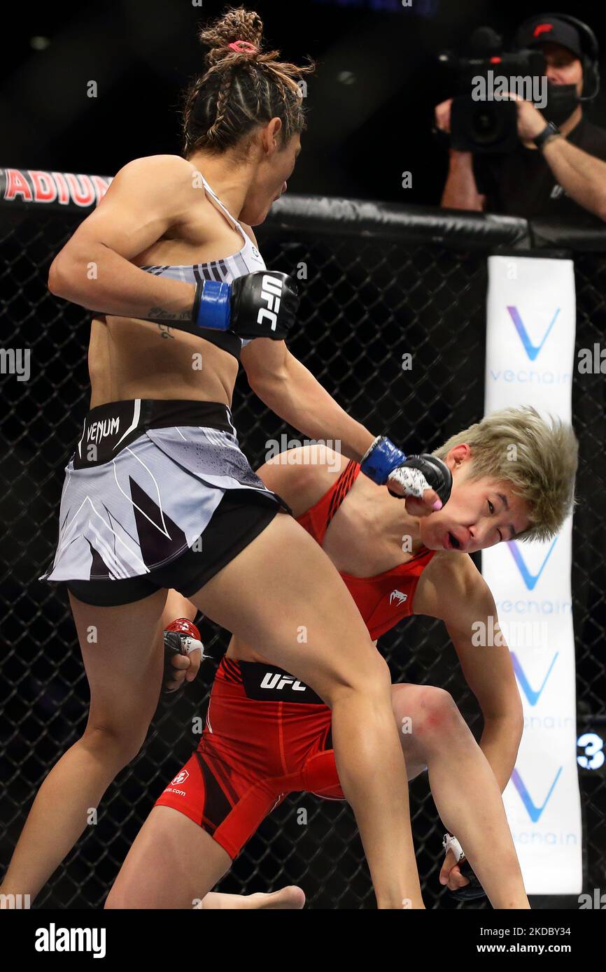 Silvana Gomez Juarez of Argentina (L) battles Liang Na of China in the women’s strawweight bout during the UFC 275 event at Singapore Indoor Stadium on June 12, 2022 in Singapore. (Photo by Suhaimi Abdullah/NurPhoto) Stock Photo