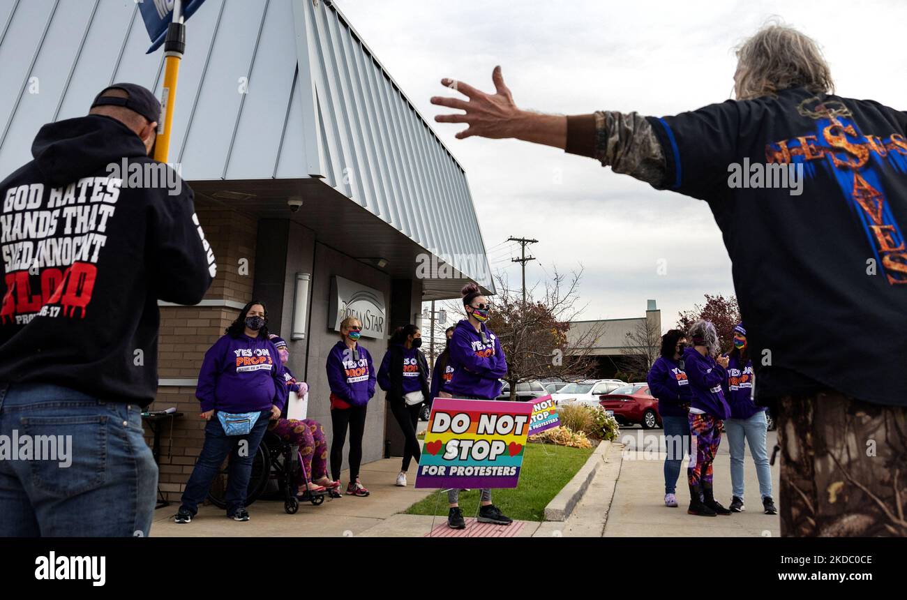 An anti-abortion demonstrator shouts towards clinic escorts at Northland Family Planning who wear sweatshirts in support of a ballot measure known as Proposal 3, which would codify the right to abortion, in Westland, Michigan, U.S., November 5, 2022. REUTERS/Evelyn Hockstein Stock Photo