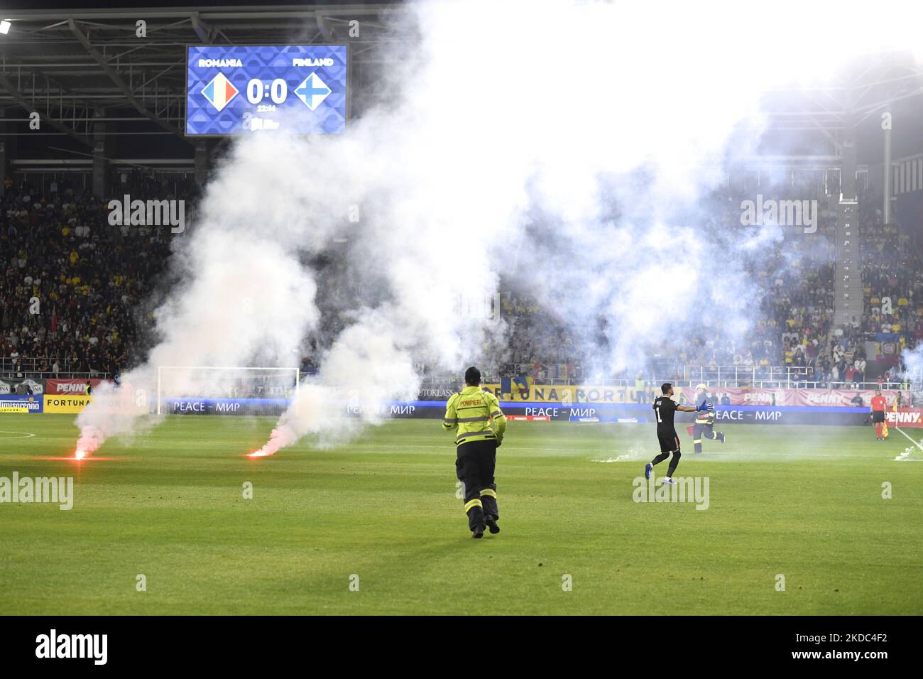 Fans use pyrotechnics in action during the UEFA Nations League -League B Group 3 match between Romania and Finland at Rapid Giulesti Stadium on June 11, 2022 in Bucharest, Romania. (Photo by Alex Nicodim/NurPhoto) Stock Photo