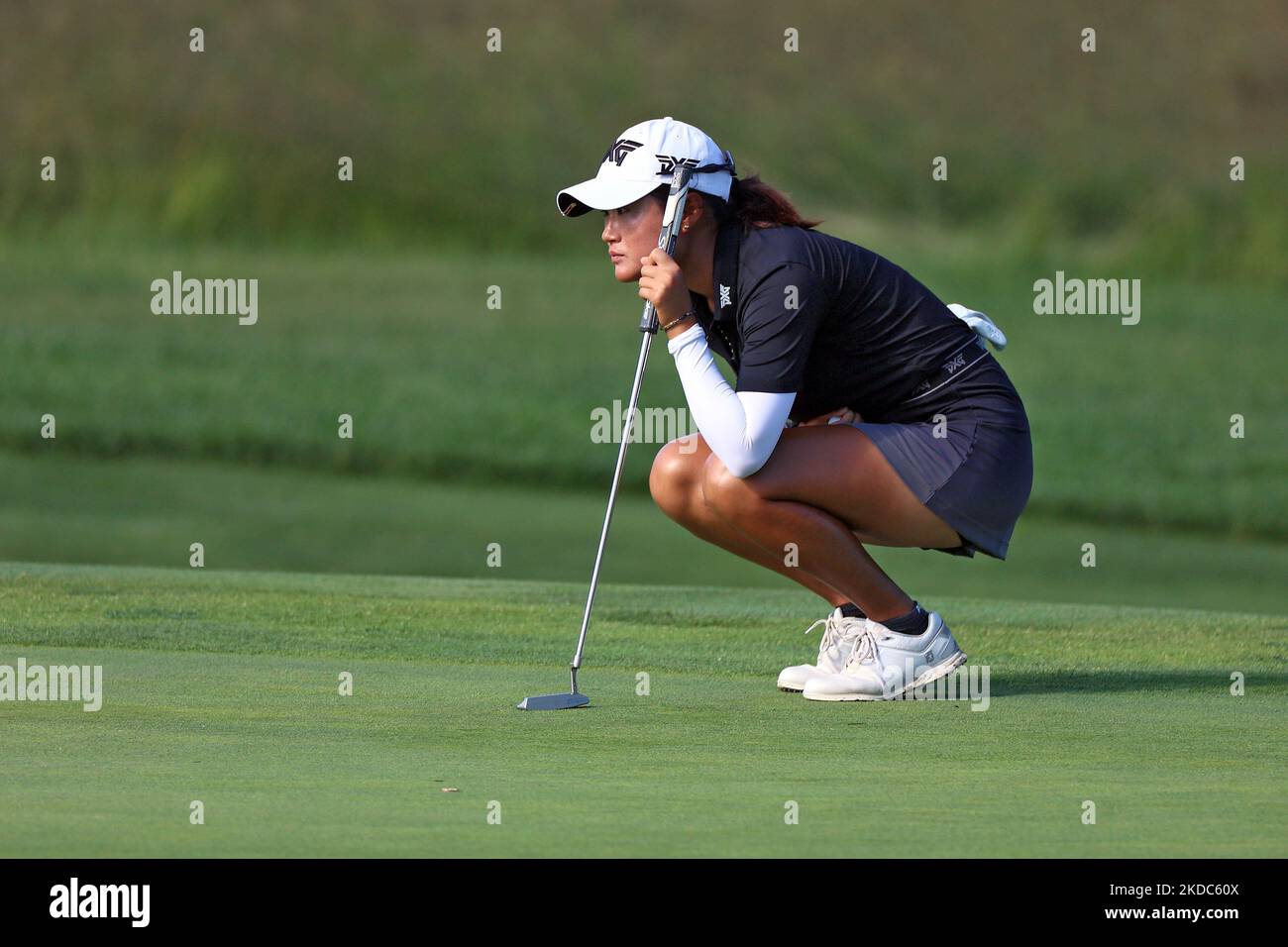 Gina Kim of Durham, North Carolina lines up her putt on the 10th green