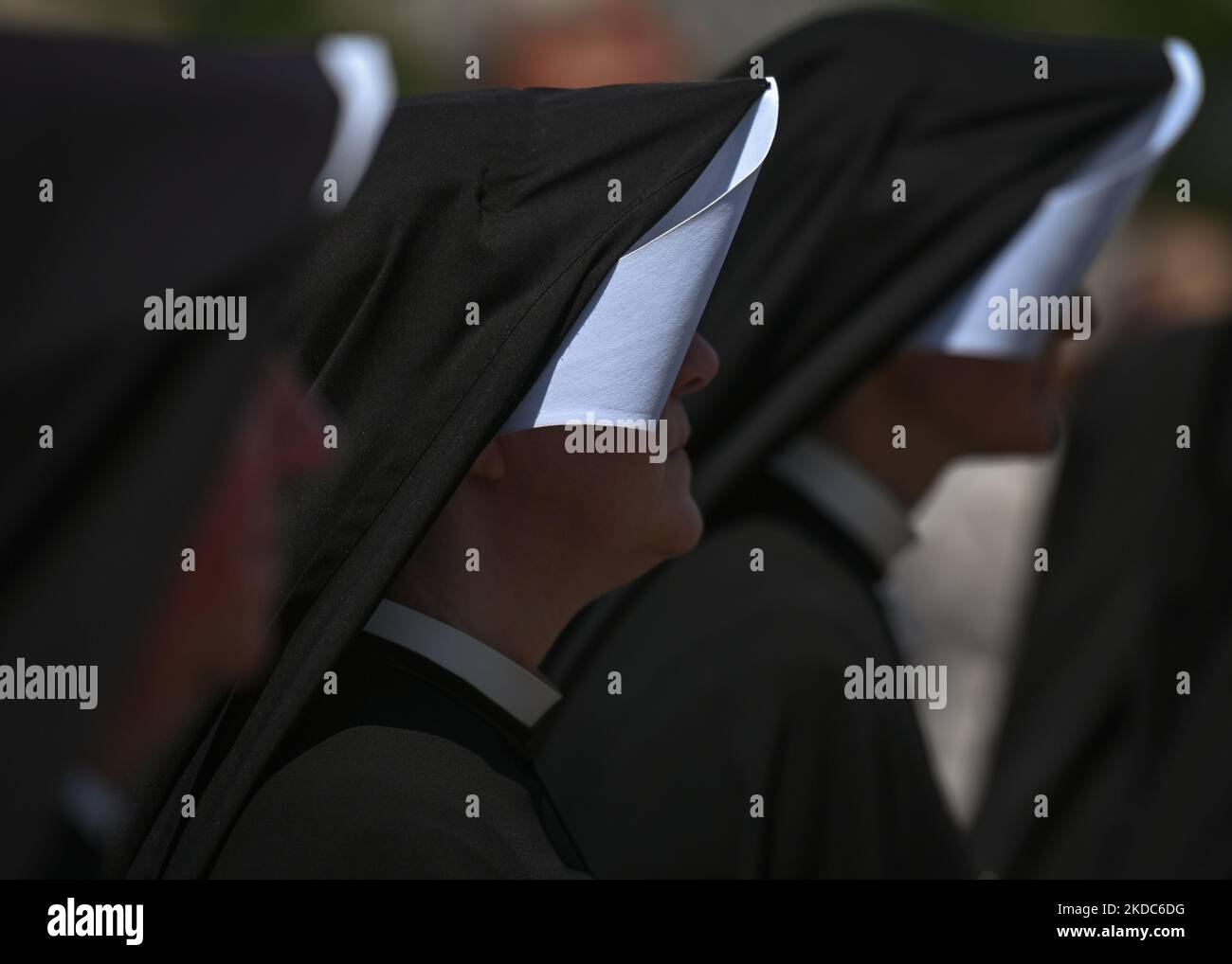 Members of local female religious congregations marching during the
