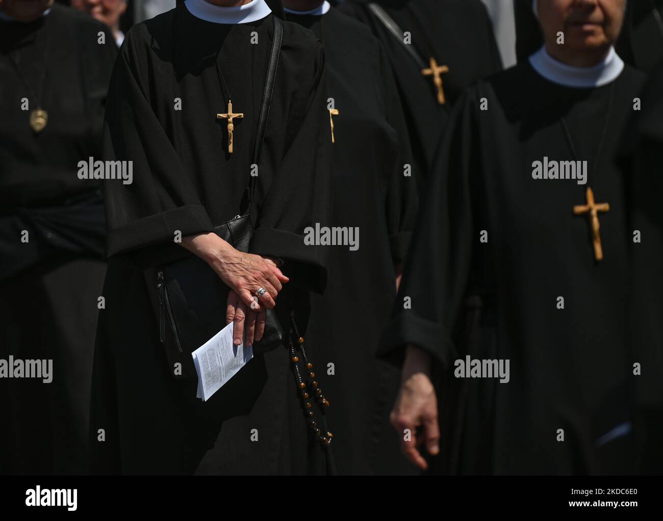 Members of local female religious congregations marching during the