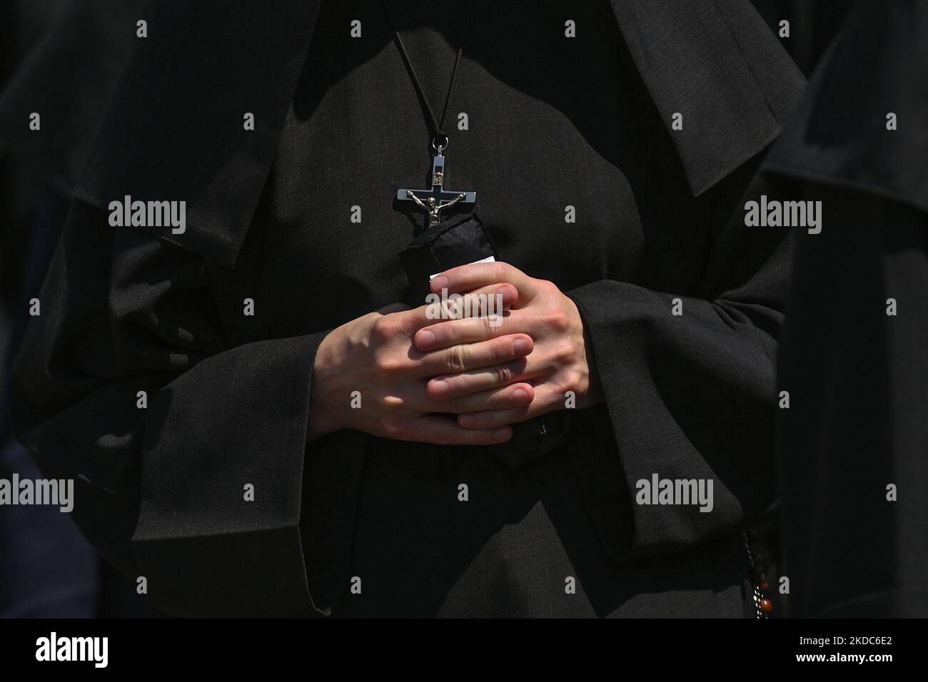 Members of local female religious congregations marching during the