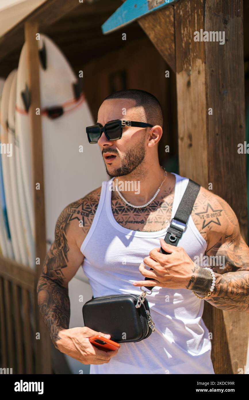 Handsome man tattoos standing hi-res stock photography and images - Alamy