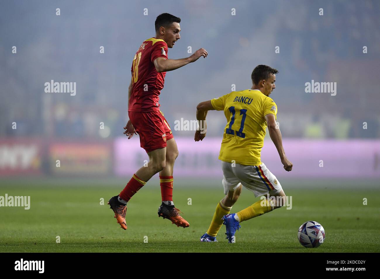 Vukan Savicevic and Nicusor Bancu in action during the UEFA Nations League -League B Group 3 match between Romania and Montenegro at Rapid Giulesti Stadium on June 14, 2022 in Bucharest, Romania. (Photo by Alex Nicodim/NurPhoto) Stock Photo