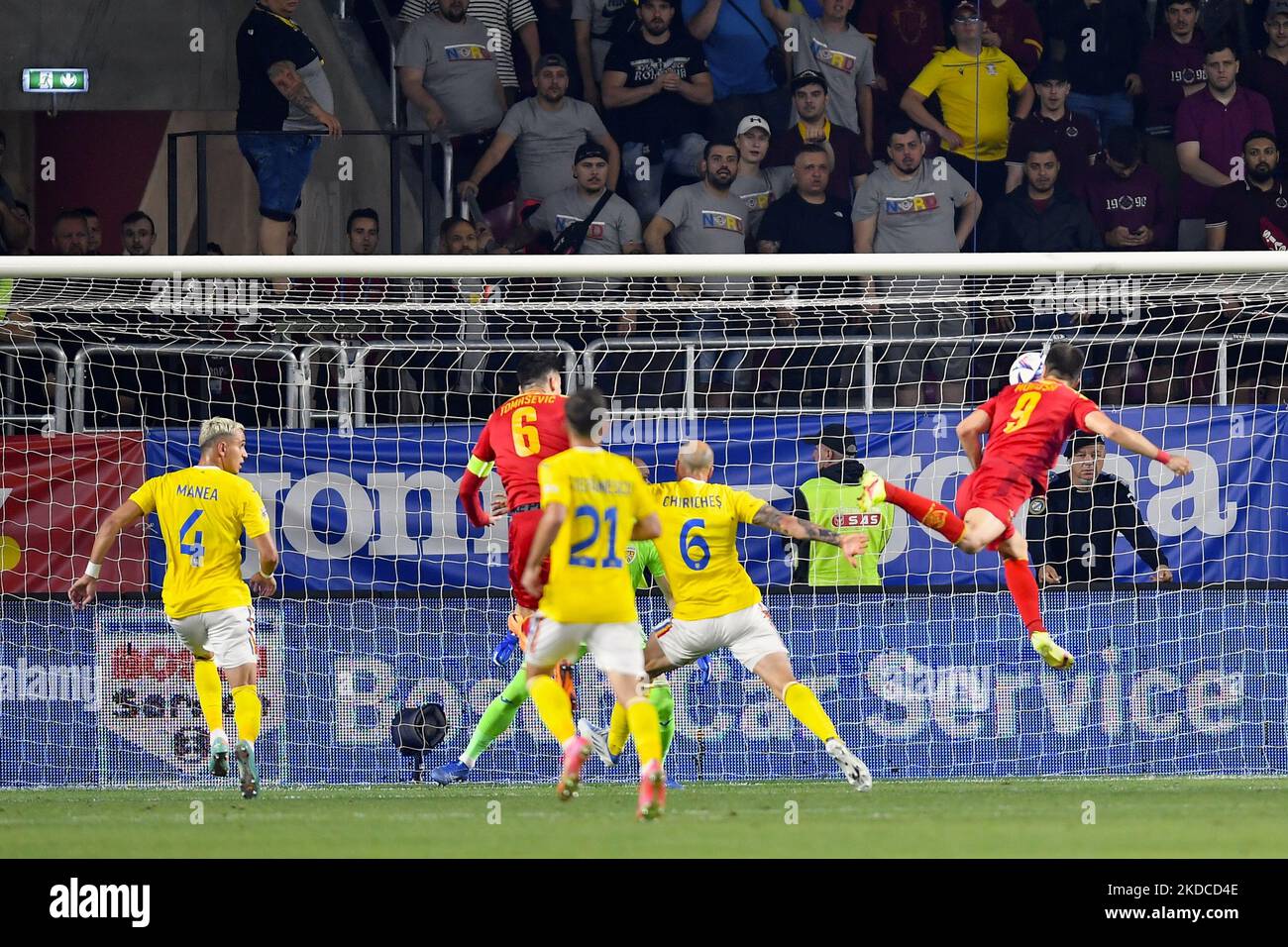 Stefan Mugosa scores his side second goal in action during the UEFA Nations League -League B Group 3 match between Romania and Montenegro at Rapid Giulesti Stadium on June 14, 2022 in Bucharest, Romania. (Photo by Alex Nicodim/NurPhoto) Stock Photo